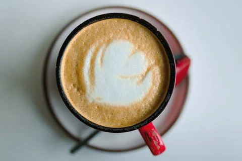 Top view of red cup of coffee, cappuccino drink to start the day Stock Photos