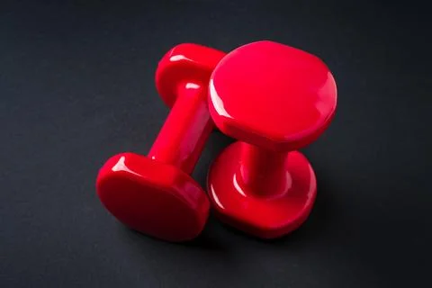 Top view red dumbbells with copy space for fitness advertising and design use Stock Photos