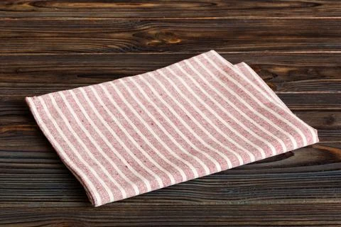 Top view with red empty kitchen napkin isolated on table background. Folded c Stock Photos