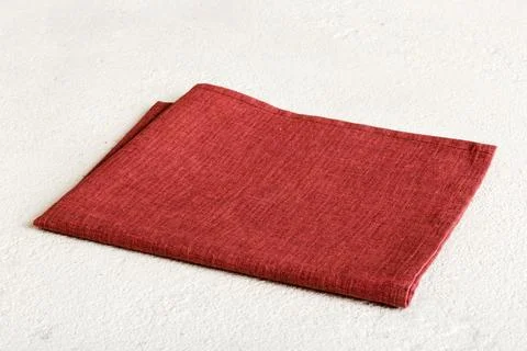 Top view with red empty kitchen napkin isolated on table background. Folded c Stock Photos