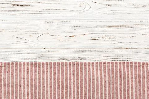 Top view with red empty kitchen napkin isolated on table background. Folded.. Stock Photos