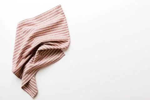 Top view with red empty kitchen napkin isolated on table background. Folded.. Stock Photos