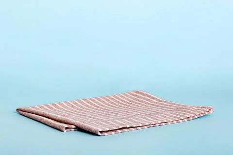 Top view with red empty kitchen napkin isolated on table background. Folded c Stock Photos