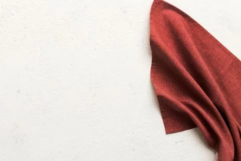 Top view with red empty kitchen napkin isolated on table background. Folded.. Stock Photos