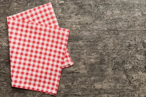 Top view with red empty kitchen napkin isolated on table background. Folded c Stock Photos