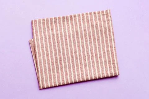 Top view with red empty kitchen napkin isolated on table background. Folded.. Stock Photos