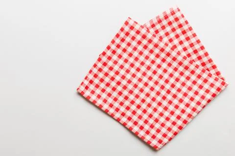 Top view with red empty kitchen napkin isolated on table background. Folded.. Stock Photos