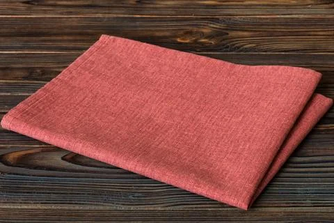Top view with red empty kitchen napkin isolated on table background. Folded c Stock Photos