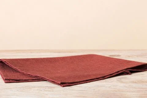 Top view with red empty kitchen napkin isolated on table background. Folded c Stock Photos