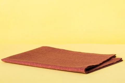 Top view with red empty kitchen napkin isolated on table background. Folded c Stock Photos
