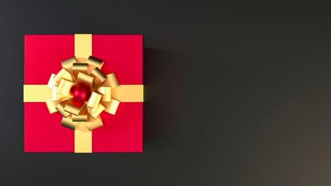 Top view of red gift box with gold ribbon and bow with copy space. Stock Photos