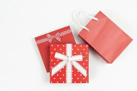 Top View of Red Gift Boxes and Paper Shopping Bag on White Background 스톡 사진