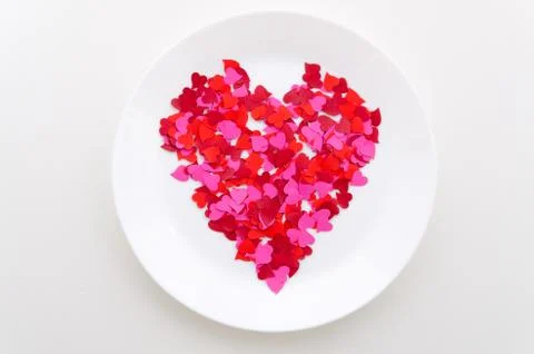 Top view red heart shape on a white plate. Romantic dinner Stock Photos