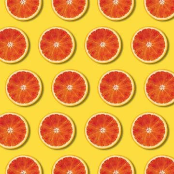 Top view red orange slices pattern on yellow background Stock Illustration