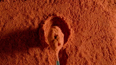 TOP VIEW: Red pepper powder is taken by a spoon Stock Footage 142048259
