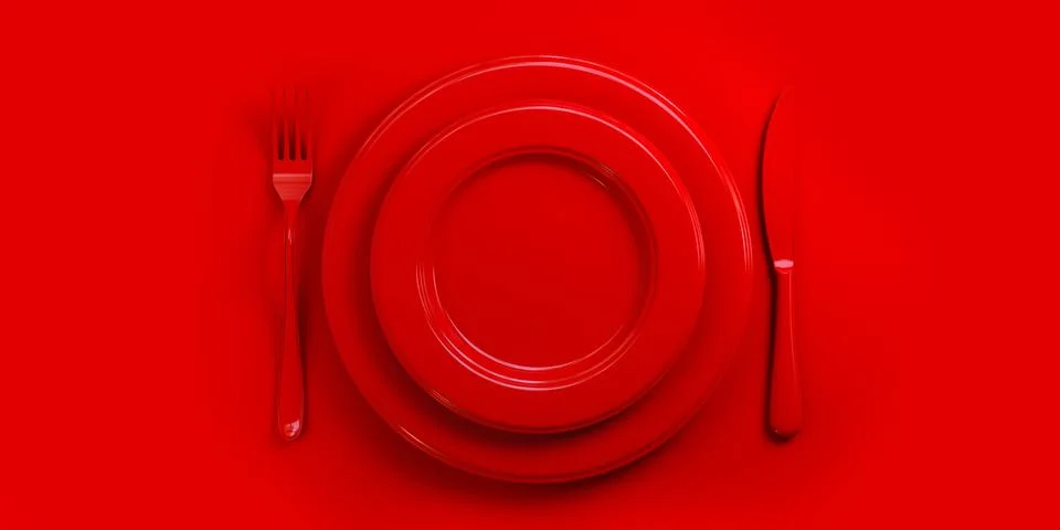 Top view of red plate, fork, knife and spoon on red table. イラスト素材