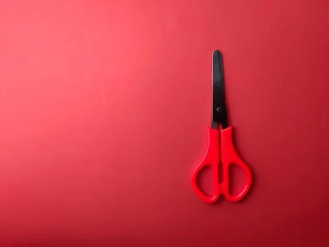 Top view red scissors on a red background Stock Photos