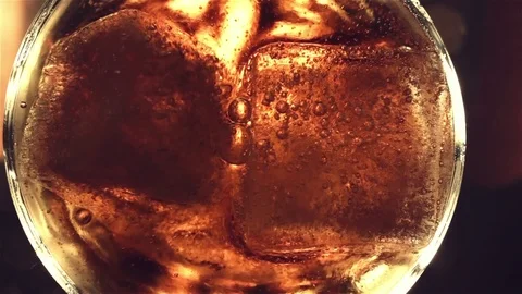 Top view. Red soft drink with ice in glass Video stock 81370368