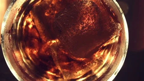 Top view. Red soft drink with ice in glass Video stock 81370473