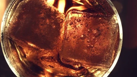 Top view. Red soft drink with ice in glass Stock Footage 81370556