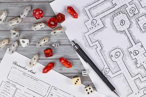 Top view of red tabletop role playing RPG game dices on blurry hand drawn Stock Photos