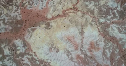 Top view of red, white and yellow eroded dry mountainous landscape. Abstract 스톡 동영상 103498374