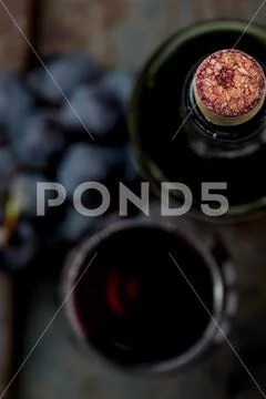 Top view of red wine bottle. Macro selective focus on wine cork. Wine bottle Stock Photos