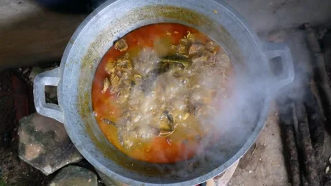 Top view of Rendang in the making on a Earthenware furnace Stock Footage 281218665