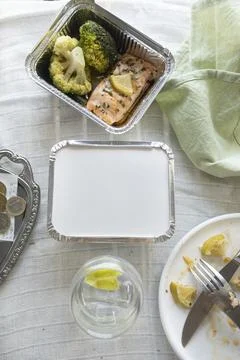 Top View of Restaurant Table After Baked Salmon Meal with Doggy Bag Request.. Foto stock
