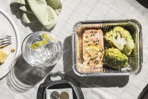 Top View of Restaurant Table After Baked Salmon Meal with Doggy Bag Request.. Stock Photos