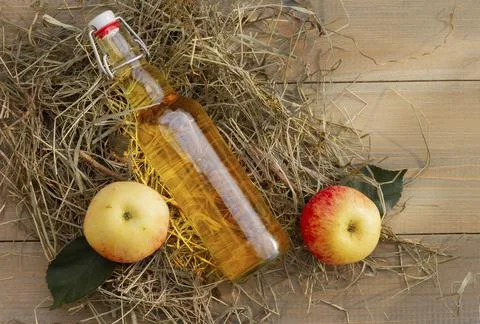 Top view of a reusable bottle with cider, homemade wine, apple juice. homemad Stock Photos