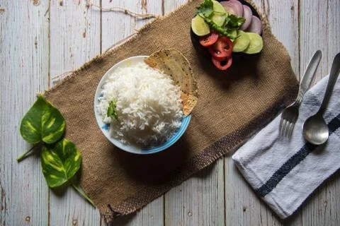 Top view rice with vegetables on a background. Stock Photos