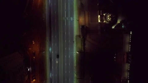 Top view at right angle on the illuminated road of the night city Video stock 135438812