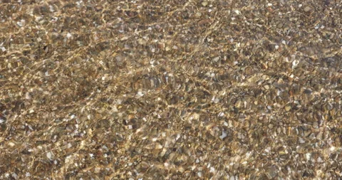 Top view of ripples and waves of clear sea water. Video stock 260245114