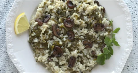 Top view of risotto with rocket and champignons. Stock Footage 311547071