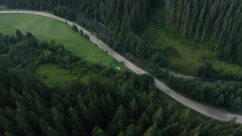 Top view of the river and its parallel road in the Carpathians, countryside in Stock Footage 140646465