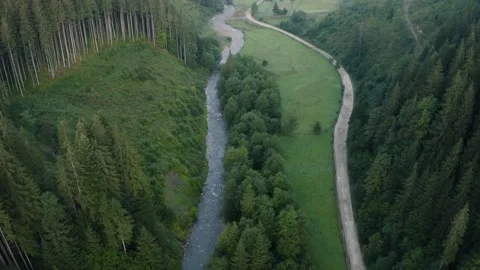 Top view of the river and its parallel road in the Carpathians, countryside in Video stock 140646480