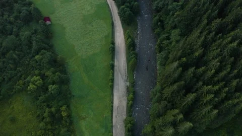 Top view of the river and its parallel road in the Carpathians, countryside in Stock Footage 140646532