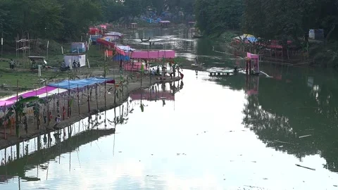 Top view of a river bank being decorated on the occasion of Chath puja in India Video stock 255992422