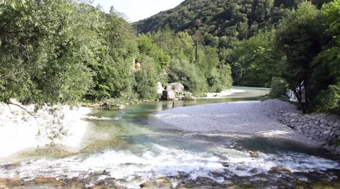 Top view of a river with vegetation stones and a fisherman Stock Footage 47993469