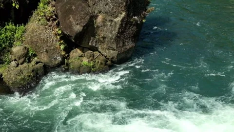 Top view of river water flowing against rocks on the riverbank 2 Stock Footage 320056378