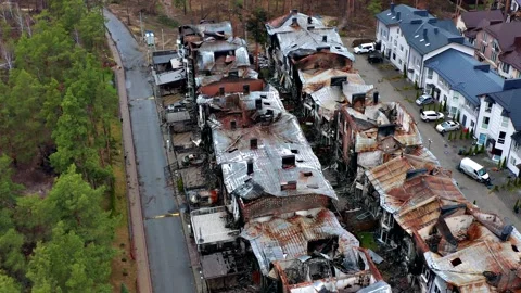 Top view of the road. Aerial view of the destroyed and burnt houses. Stock Footage 226587928