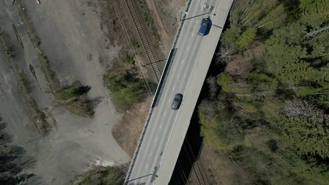 Top view of road bridge and railway crossing. Vehicles crossing the bridge. Stock Footage 241137623
