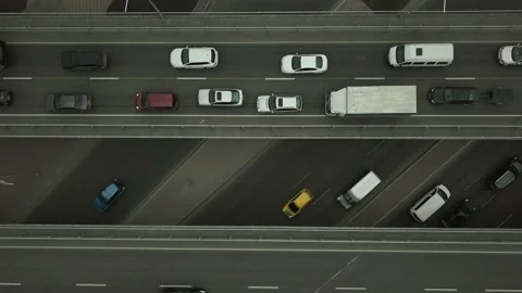 Top view of the road junction and bridges. one of the car lanes is moving slowly Stock Footage 152717476