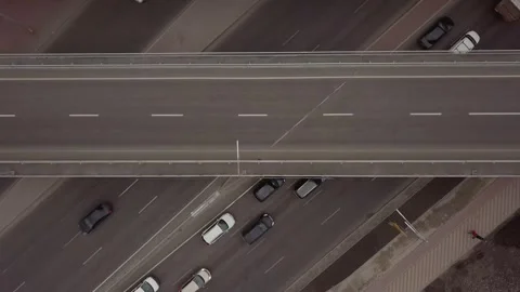 Top view of the road junction and bridges. one of the car lanes is moving slowly Stock Footage 153601817