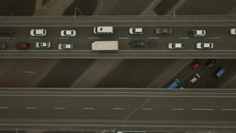 Top view of the road junction and bridges. one of the car lanes is moving slowly Stock Footage 154237097