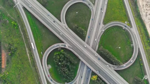 Top view of the road junction on the highway. Cars move along the trestle road Stock Footage 210511054