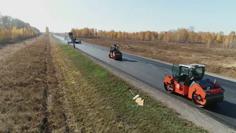 Top view. Road surface repair. Construction of a new road. Loading the asphalt Stock Footage 138537916