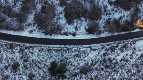 Top View Of A Road Through Winter Mountains. Aerial Shot Stock Footage 296238735