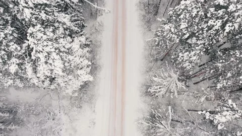 Top view of road in winter snow-covered forest Video stock 154440449